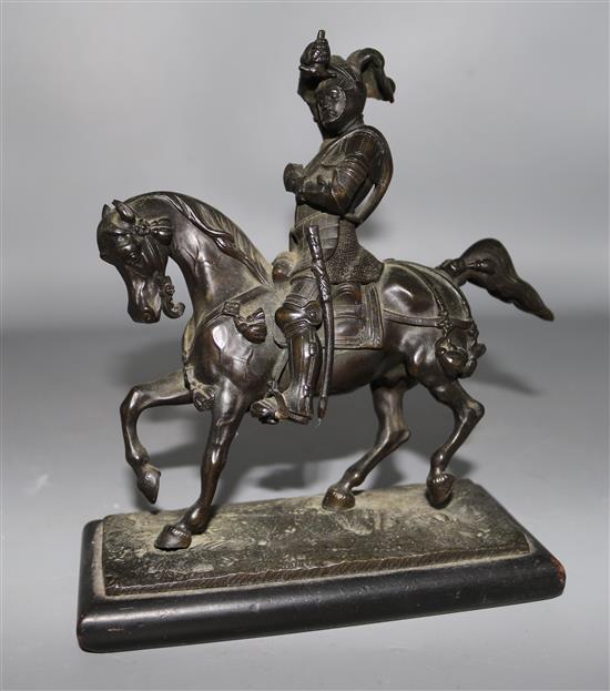 A bronze model of a knight on a horse